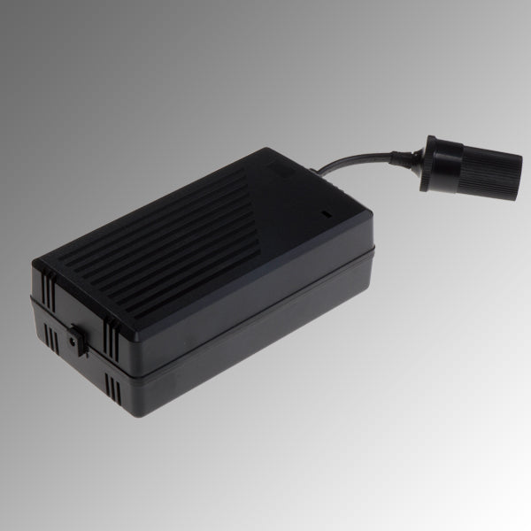 Black rectangular lithium battery pack with ventilation slits and attached connector cable.