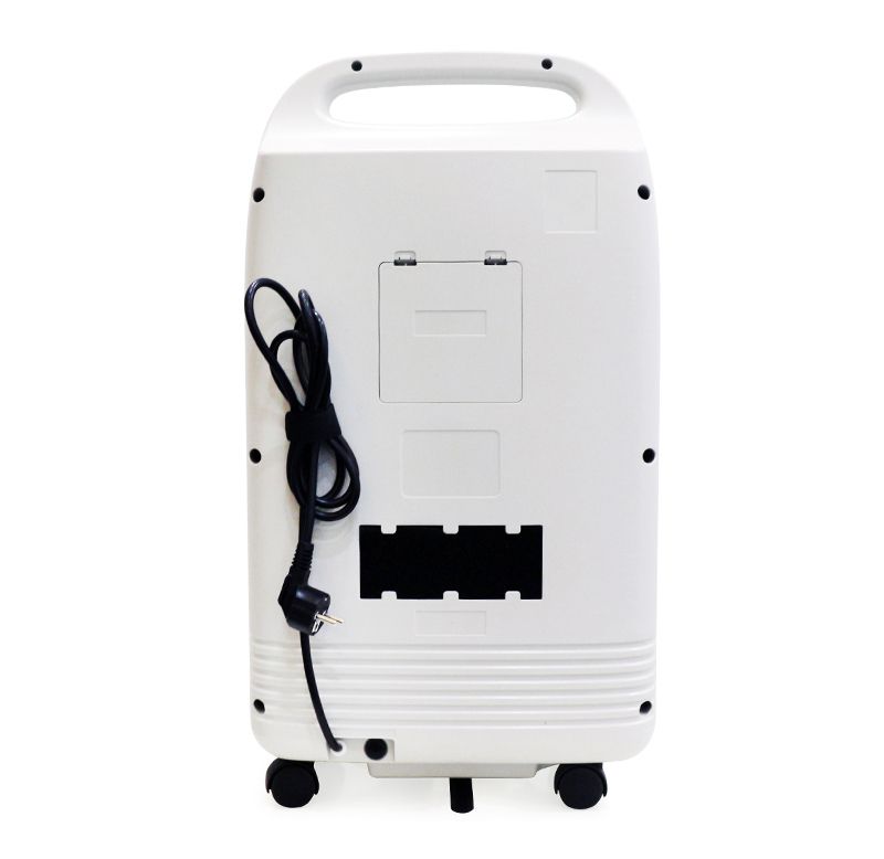 White stationary oxygen concentrator with built-in handle, power cord, and caster wheels on the bottom.