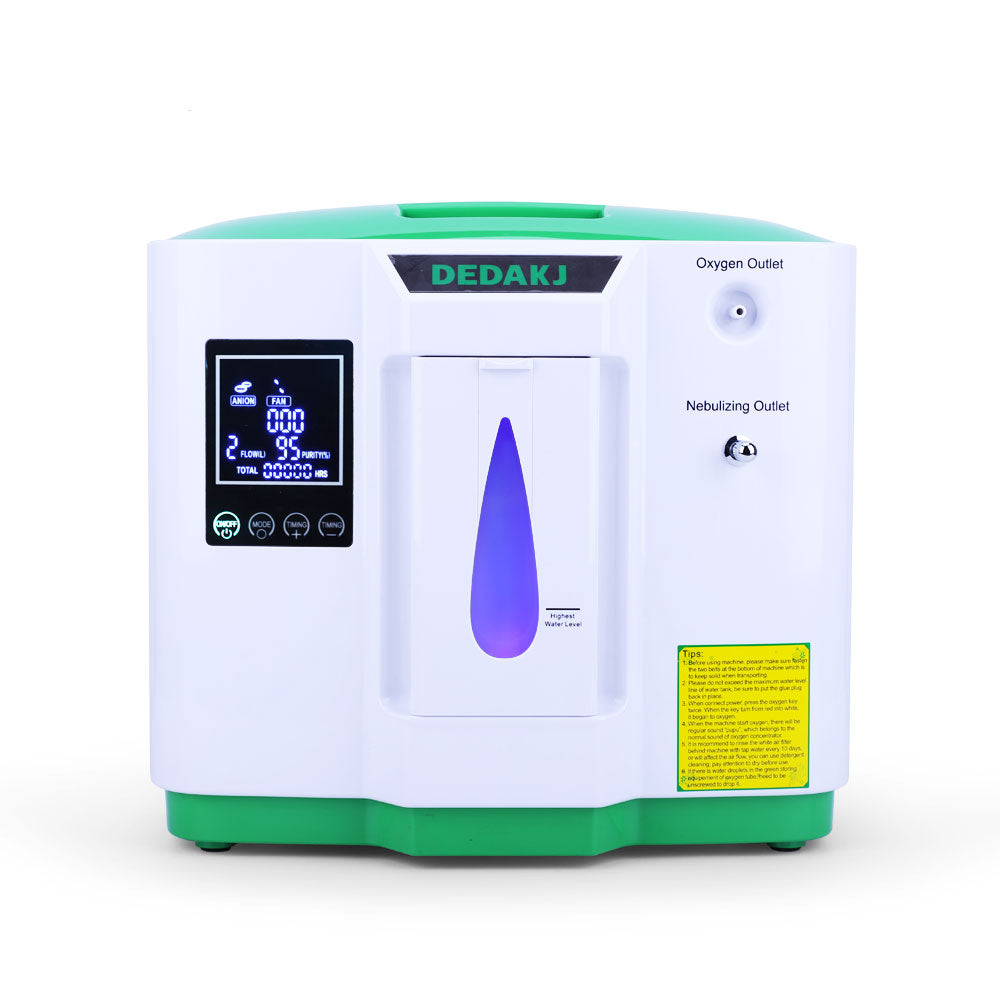 White and green oxygen concentrator with LED display, water level indicator, and labeled oxygen and nebulizing outlets.