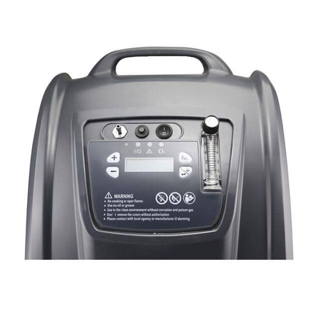 Top control panel of Aerti 5L oxygen concentrator with display, buttons, flow meter, and warning labels.