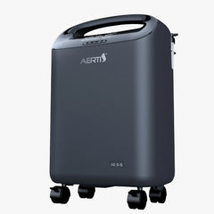 Dark gray Aerti oxygen concentrator with handle, digital display, control buttons, and four caster wheels.