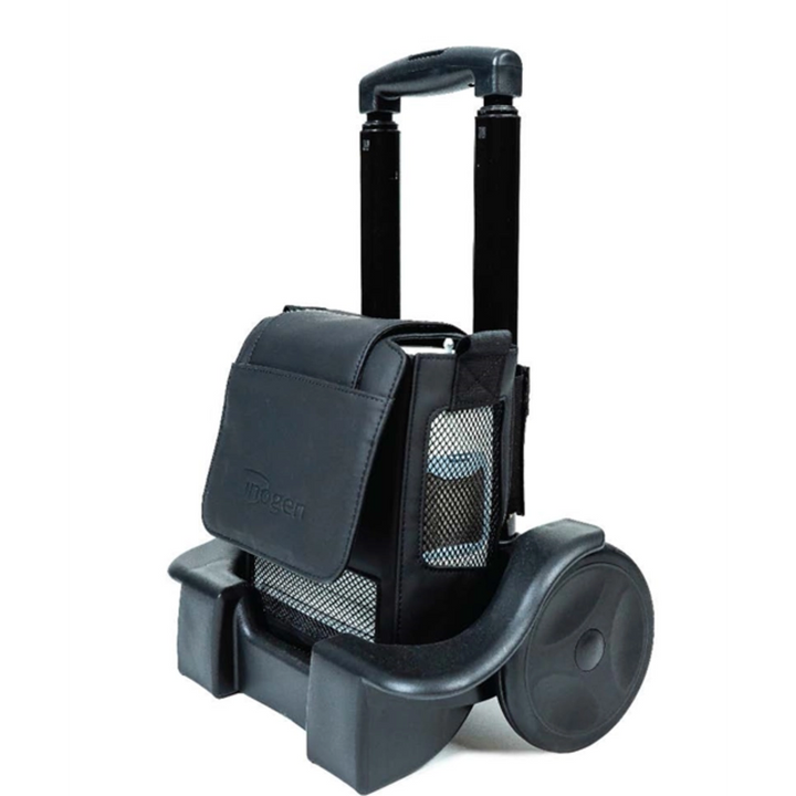 Compact black trolley cart with extendable handle, large rubber wheels, and mesh side pockets.