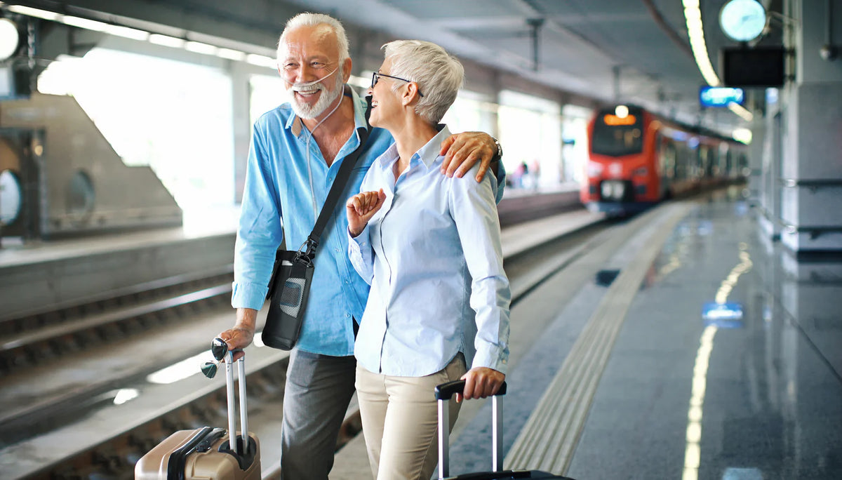 An older couple enjoying a journey together with portable oxygen