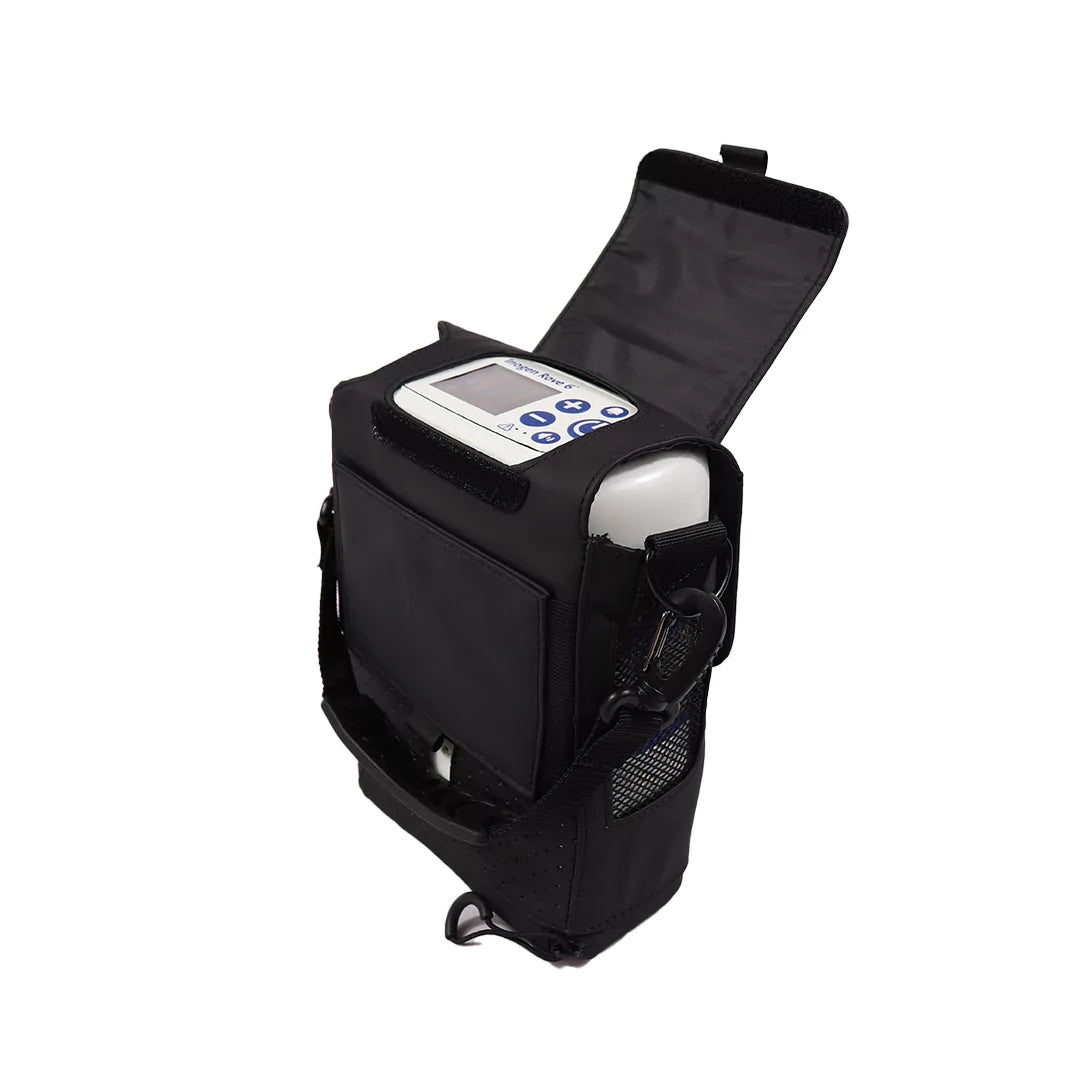 Compact white oxygen concentrator in black carrying case with open flap and control panel visible.