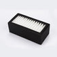Rectangular air filter with white pleated material inside a black plastic frame.