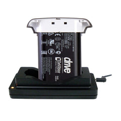 Black and white Devilbiss iGo2 battery inserted in a black AC power supply charger with indicator light.